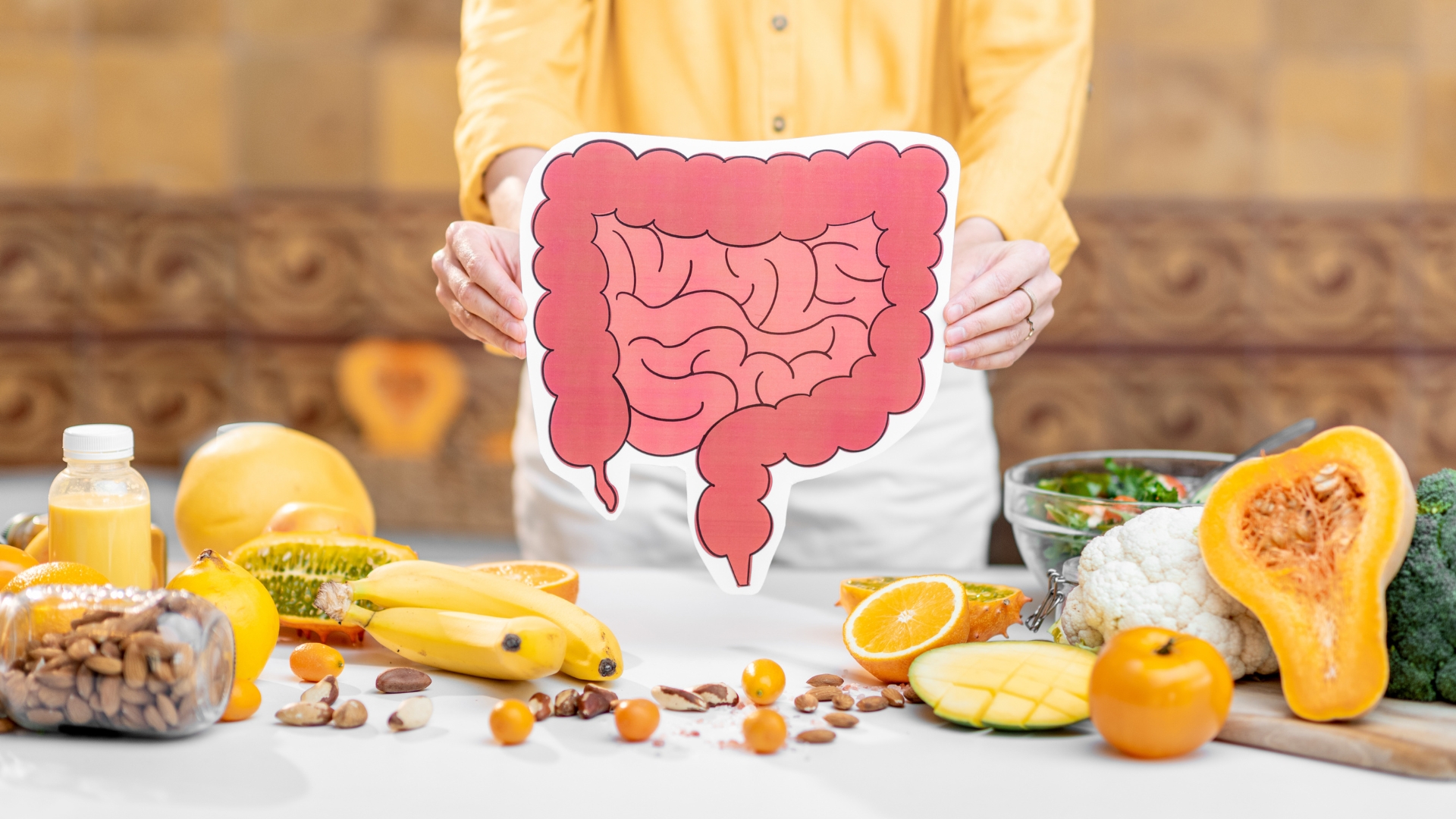 Bowls of gut friendly foods including yoghurt, kefir, sauerkraut, kimchi, oats and leafy greens