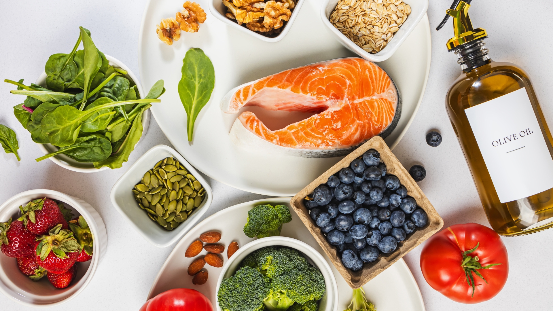 Balanced meal plate with salmon, quinoa, avocado and colourful vegetables