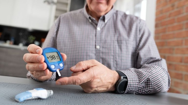 Person checking their blood glucose levels with a glucometer